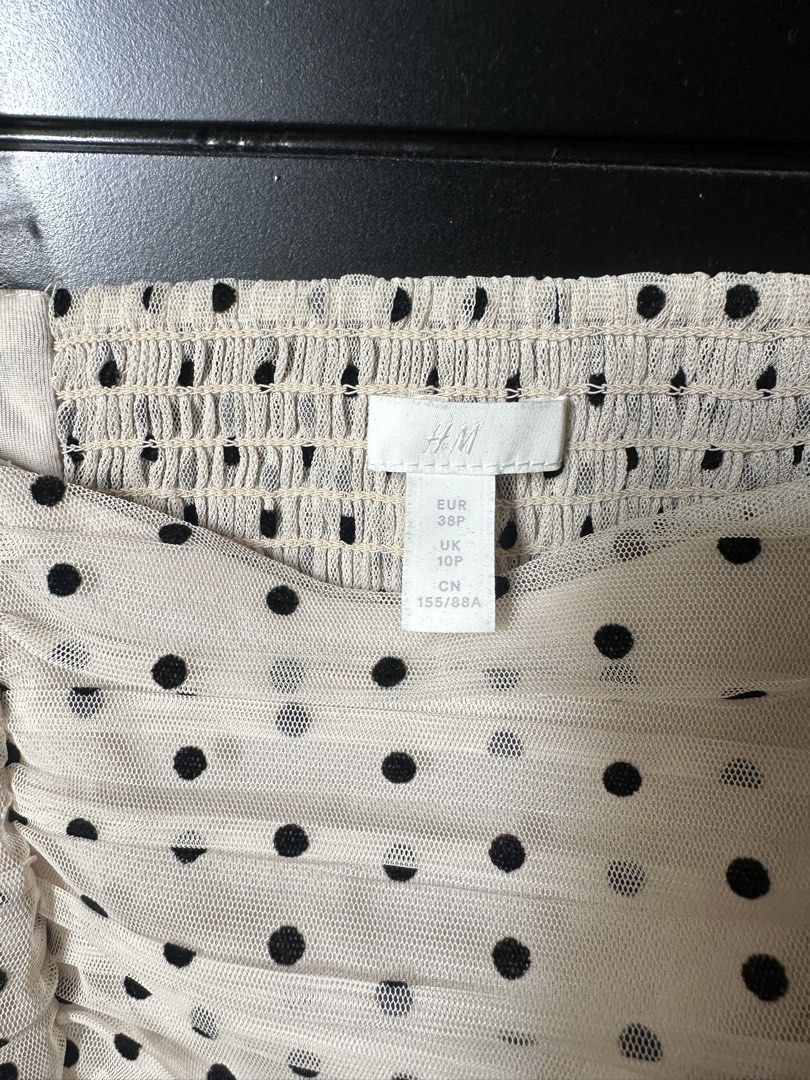 H&M Polka Dot Mesh Square Neck Puff Sleeve Top (Category: Blouses) located in Paranaque City. Submitted by _tonkatsuclub (Listing ID 1463624757, Image 2). Description: - Cream mesh top with black polka dots - Square neckline - Ruched detailing on the front - Puff sleeves with ruffled cuffs.