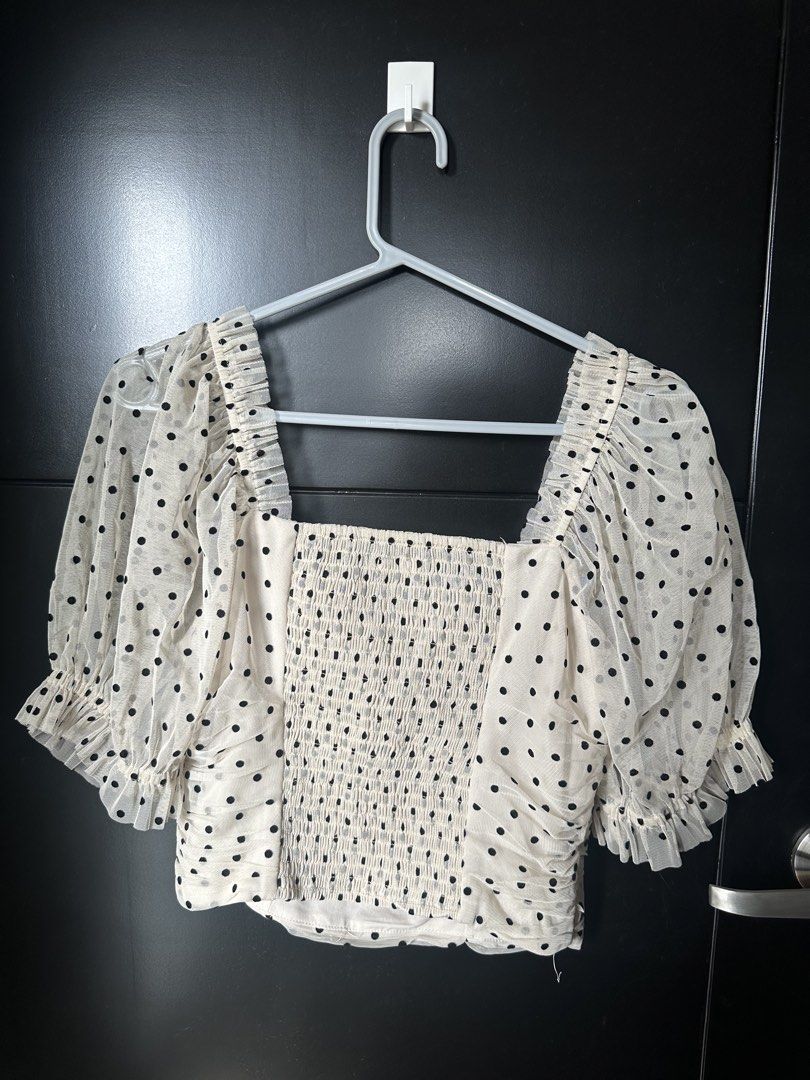 H&M Polka Dot Mesh Square Neck Puff Sleeve Top (Category: Blouses) located in Paranaque City. Submitted by _tonkatsuclub (Listing ID 1463624757, Image 3). Description: - Cream mesh top with black polka dots - Square neckline - Ruched detailing on the front - Puff sleeves with ruffled cuffs.