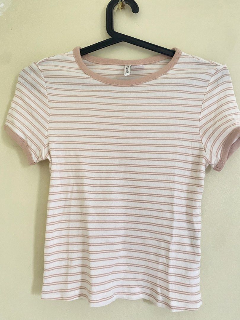 H&M Striped Cropped T-shirt (Category: Shirts) located in Quezon City. Submitted by abssnf (Listing ID 1463619638, Image 1). Description: - H&M cropped t-shirt - White and beige stripes - Short sleeves with contrasting trim - Round neckline - Soft and comfortable fabric - Perfect for casual outfits.
