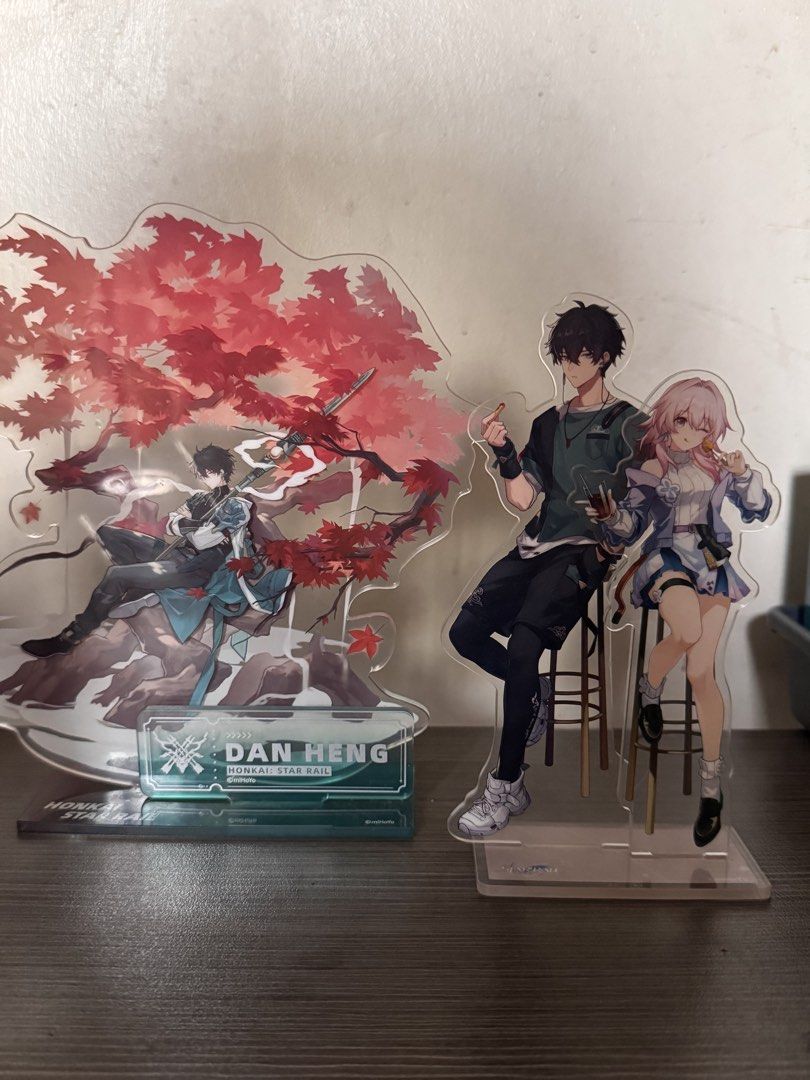 Honkai Star Rail Dan Heng + March 7th Acrylic Standee Set (Category: Character Goods) located in Quezon City. Submitted by friedpalitaw (Listing ID 1463645261, Image 1). Description: Price listed is for both standees! Official HSR Dan Heng standee + DanMarch standee from Mihoyo - Bought during HSE Mann Hann collab event in 2023 - Protective plastic film is removed from the bases but remains on the characters - Items were displayed on a shelf away