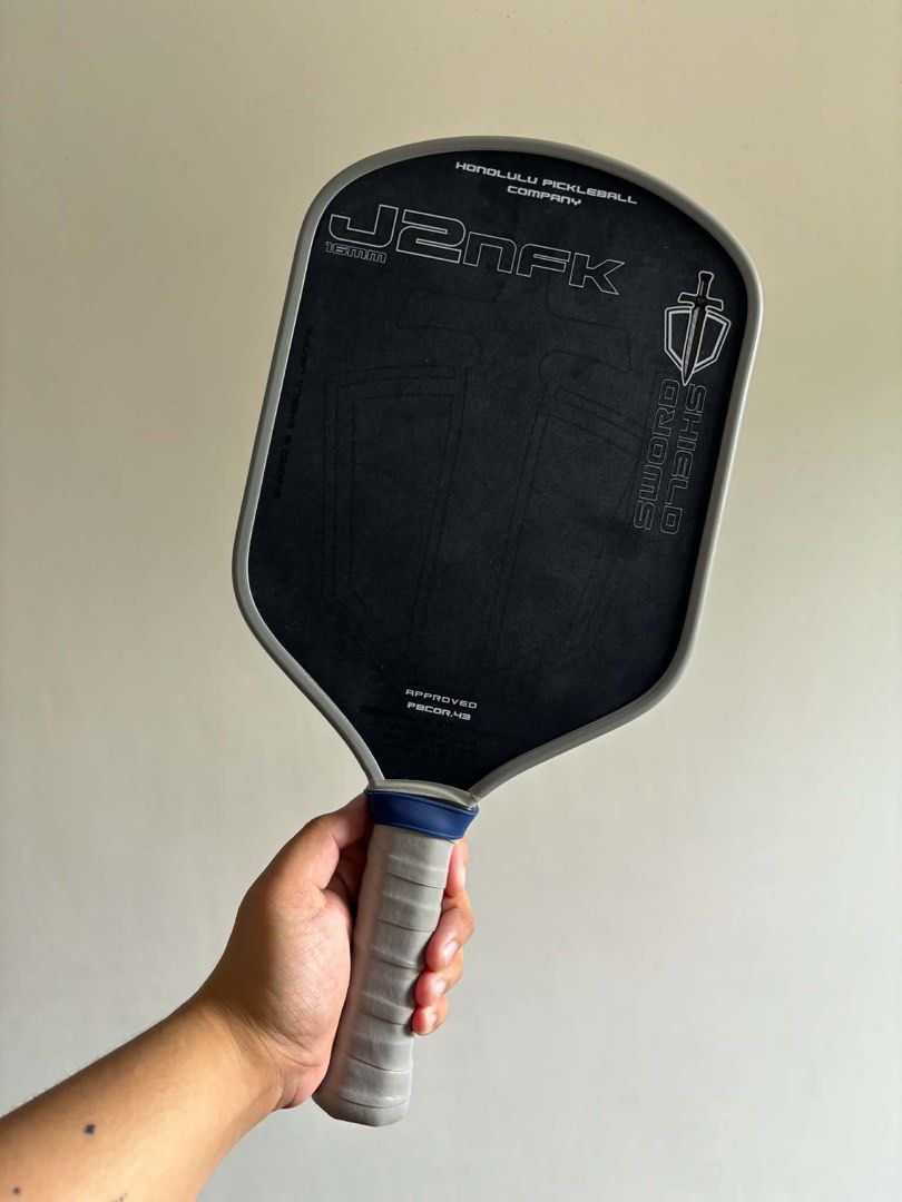 Honolulu Pickleball Company J2NFK Sword & Shield Paddle (Category: Racket and Ball Sports) located in Cavite. Submitted by justinnechiu (Listing ID 1463656263, Image 1). Description: Helping a friend to sell her 1st paddle. - Honolulu Pickleball Company J2NFK Paddle - Sword & Shield Model - USAPA Approved - Includes Protective Case RFS: Change Paddle Orig Price: 13,495 Slightly Nego.