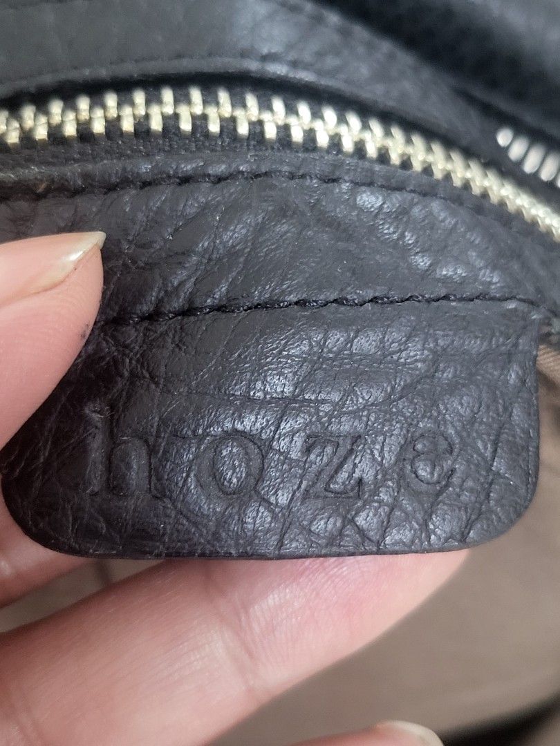 Hoze Black Leather Handbag (Category: Shoulder Bags) located in Manila. Submitted by milkymitch23 (Listing ID 1463630715, Image 3). Description: - Brand: Hoze - Color: Black - Material: Leather with pebbled texture - Compartments: Two main zip compartments - Pockets: Front clasp pocket, interior zip pocket - Origin: Made in Korea - Size: Ideal for daily use - nego pa .