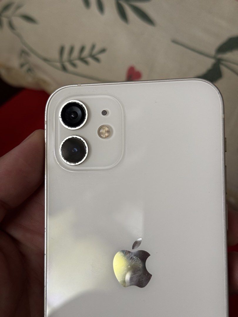iPhone 12 64GB FU PRELOVED! (Category: iPhone 12 Series) located in Manila. Submitted by marco.21 (Listing ID 1463687064, Image 2). Description: Preloved iPhone 12 - 64GB storage - White color -68 Battery Health Honest Issue!: palit lcd na pero goods naman sya no ghost touch then yung camera lens kita naman sa pics replaced na nabasag kasi last time malabo na yung .5 camera nya un lang issue pero still goods!.