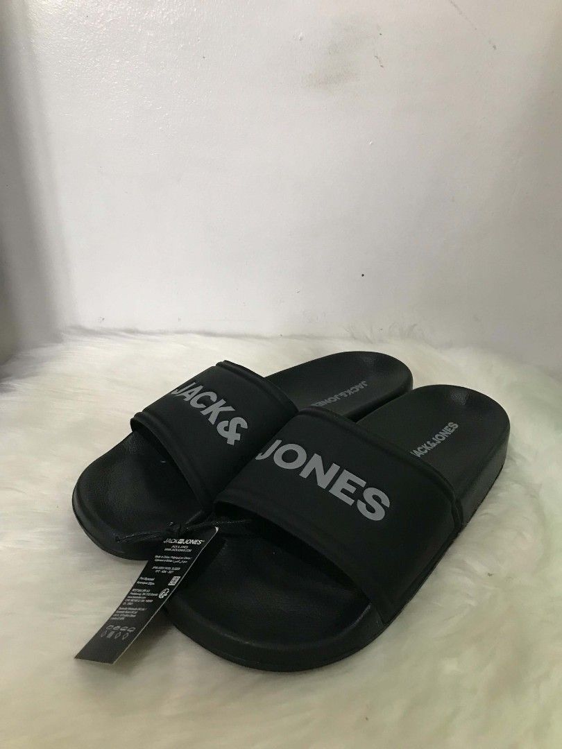 Jack & Jones Black Slides (Category: Slippers & Slides) located in Manila. Submitted by vincent.seller (Listing ID 1463608060, Image 3). Description: - Brand: Jack & Jones - Color: Black - Design: Simple and classic - Features: Clearly printed brand name on strap, easy slip-on/off - Ideal for: Casual wear, lounging, everyday use.