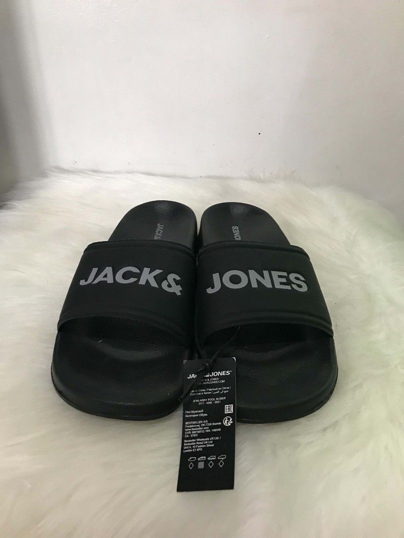 Jack & Jones Black Slides (Category: Slippers & Slides) located in Manila. Submitted by vincent.seller (Listing ID 1463608060, Image 1). Description: - Brand: Jack & Jones - Color: Black - Design: Simple and classic - Features: Clearly printed brand name on strap, easy slip-on/off - Ideal for: Casual wear, lounging, everyday use.