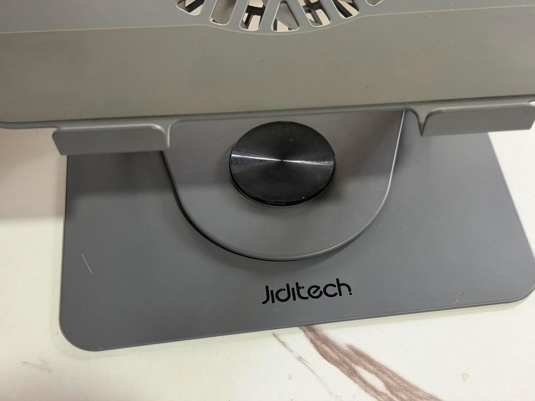 Jiditech 360° Rotating Bracket Laptop Stand with Fan (Category: Other Accessories) located in Silang. Submitted by eburi (Listing ID 1463621159, Image 3). Description: Jiditech 360° Rotating Bracket Laptop Stand with Fan - Magnetic detachable turbo fan - Silicone protection protects your machine Large area silicone pad - Dual devices on the same rack Free your desktop - Infinite rotation, adjust to where you want it - Can be used on laptops/table