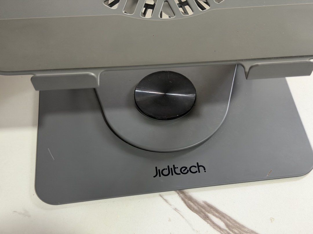 Jiditech Adjustable Laptop Stand with Cooling Fan (Category: Laptops & Notebooks) located in Silang. Submitted by honjinu (Listing ID 1463622254, Image 2). Description: Jiditech 3 IN 1 Laptop Stand With Fan - Used but not abused - Fan works excellently - Magnetic detachable turbo fan - Silicone protection protects your machine Large area silicone pad - Dual devices on the same rack Free your desktop - Infinite rotation, adjust to where you want i