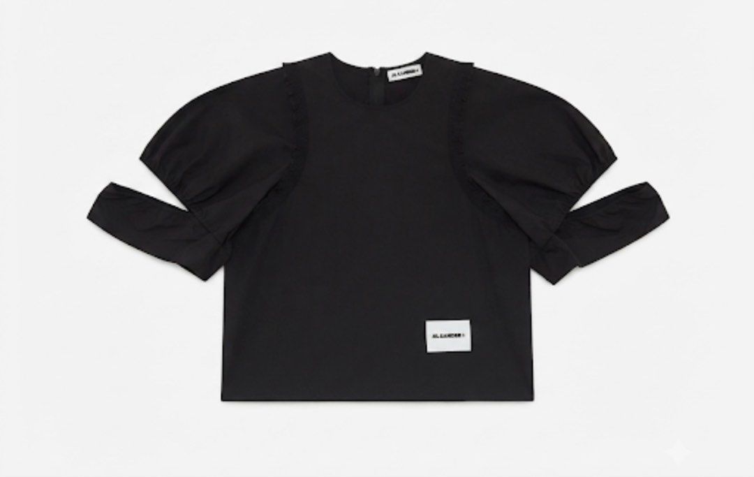 Jil Sander+ Black Puff Sleeve Cut-Out Top (Category: Blouses) located in Donsol. Submitted by saksthriftavenuebyluckymaria8 (Listing ID 1463711722, Image 2). Description: - Black Jil Sander+ top - Dramatic puff sleeves with cut-out details - Ruffled trim along shoulder seams - Classic crew neck - Convenient back zipper closure - Small Jil Sander+ logo tag on front hem - Made in Italy Jil sander cut out sleeves black top sz M chest 21in armhole 13