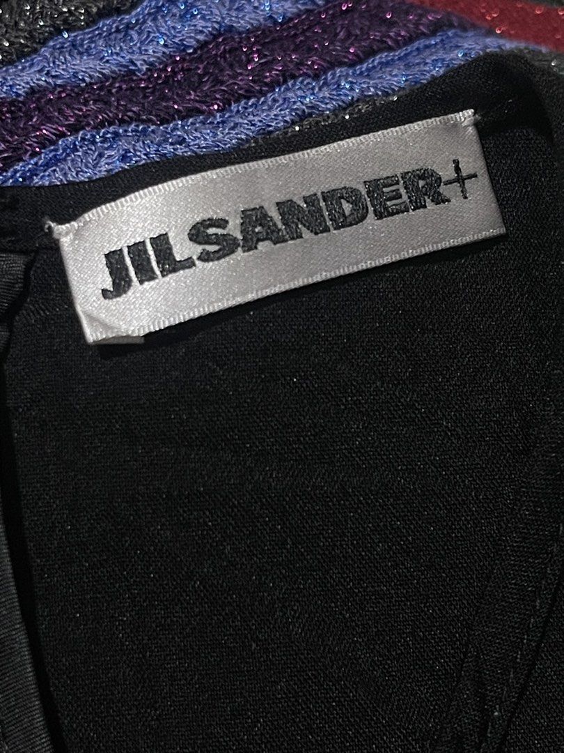 Jil Sander+ Black Puff Sleeve Cut-Out Top (Category: Blouses) located in Donsol. Submitted by saksthriftavenuebyluckymaria8 (Listing ID 1463711722, Image 3). Description: - Black Jil Sander+ top - Dramatic puff sleeves with cut-out details - Ruffled trim along shoulder seams - Classic crew neck - Convenient back zipper closure - Small Jil Sander+ logo tag on front hem - Made in Italy Jil sander cut out sleeves black top sz M chest 21in armhole 13