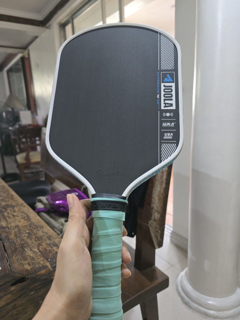 JOOLA Hyperion 16mm Pickleball Paddle (Category: Racket and Ball Sports) located in Paranaque City. Submitted by b.amore (Listing ID 1463711086, Image 1). Description: - JOOLA Hyperion 16mm pickleball paddle - bought in ATC mall alabang, original Price at Php 16k - Features Simone Jardim signature - Comes with a JOOLA paddle cover - Teal grip tape on handle - Ideal for playing pickleball - Power-Control balance - with new edge guard and overgrip 