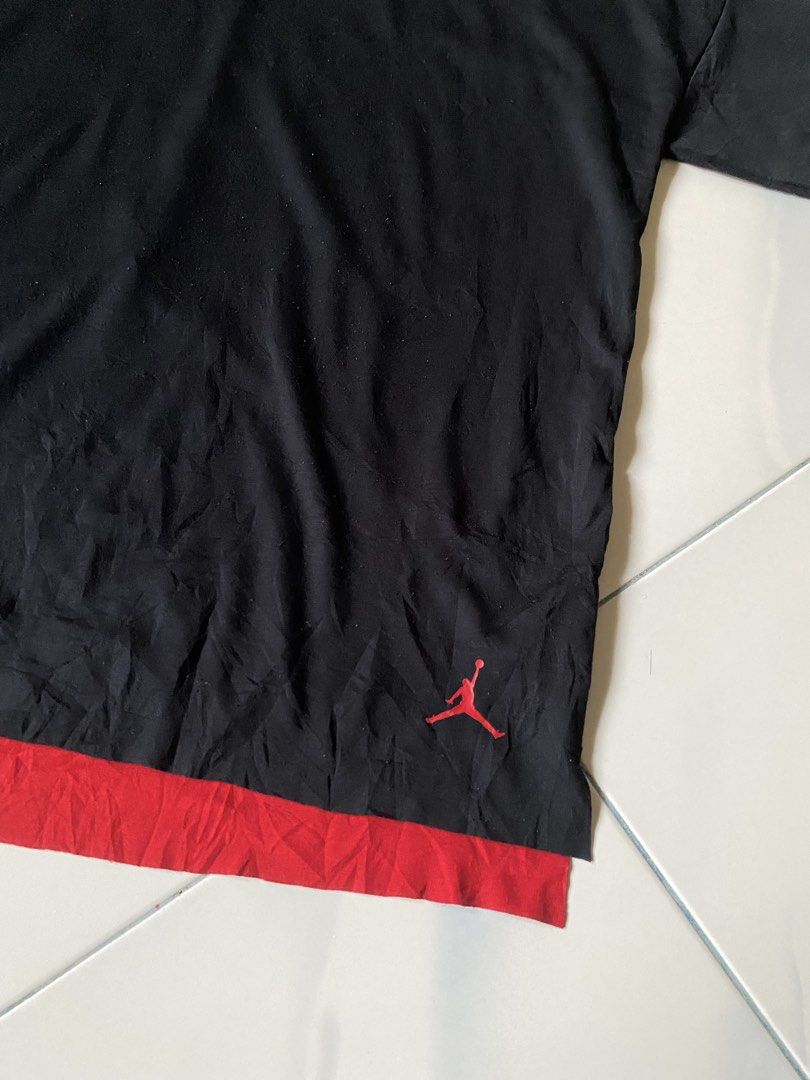 Jordan Brand T-Shirt Black Red Double Layer (Category: Tshirts & Polo Shirts ) located in Borongan. Submitted by cybutdiff (Listing ID 1463585487, Image 2). Description: - Authentic Black Jordan T-shirt - Size: XXL - Features a stylish red double layer hem - Iconic red Jumpman logo on the lower front - Perfect for casual everyday wear - Made in China.