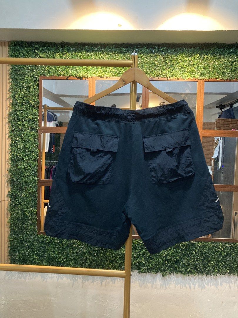 Jordan Cargo Shorts Black (Category: Shorts) located in Trece Martires City. Submitted by thriftkoto.91 (Listing ID 1463699500, Image 2). Description: - Black Jordan cargo shorts - Elastic waistband with drawstring - Multiple front and back pockets - Jordan logo on left leg - '23ENGINEERED' text on right leg - Ideal for casual wear.