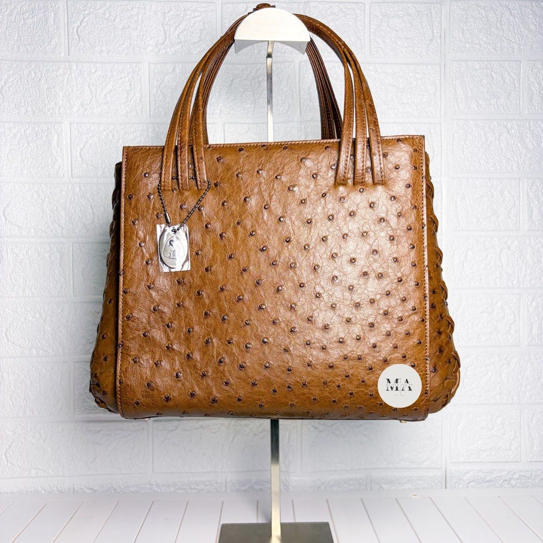 JRA Coded 155 Ostrich Leather Handbag (Category: Luxury Bags & Wallets) located in Manila. Submitted by maisonavoire (Listing ID 1463591453, Image 1). Description: 𝐉𝐑𝐀 𝐂𝐨𝐝𝐞𝐝 𝟏𝟓𝟓 𝐎𝐬𝐭𝐫𝐢𝐜𝐡 𝐋𝐞𝐚𝐭𝐡𝐞𝐫 𝐇𝐚𝐧𝐝𝐛𝐚𝐠 – 𝐁𝐫𝐨𝐰𝐧 𝐃𝐢𝐦𝐞𝐧𝐬𝐢𝐨𝐧𝐬: 28 cm × 13 cm × 23 cm 𝐌𝐚𝐭𝐞𝐫𝐢𝐚𝐥: Genuine Ostrich Leather featuring the distinctive natural quill pattern characteristic of genuine ostrich hide. 𝐃𝐢𝐬𝐭𝐢𝐧𝐜𝐭𝐢𝐯𝐞 𝐅𝐞𝐚