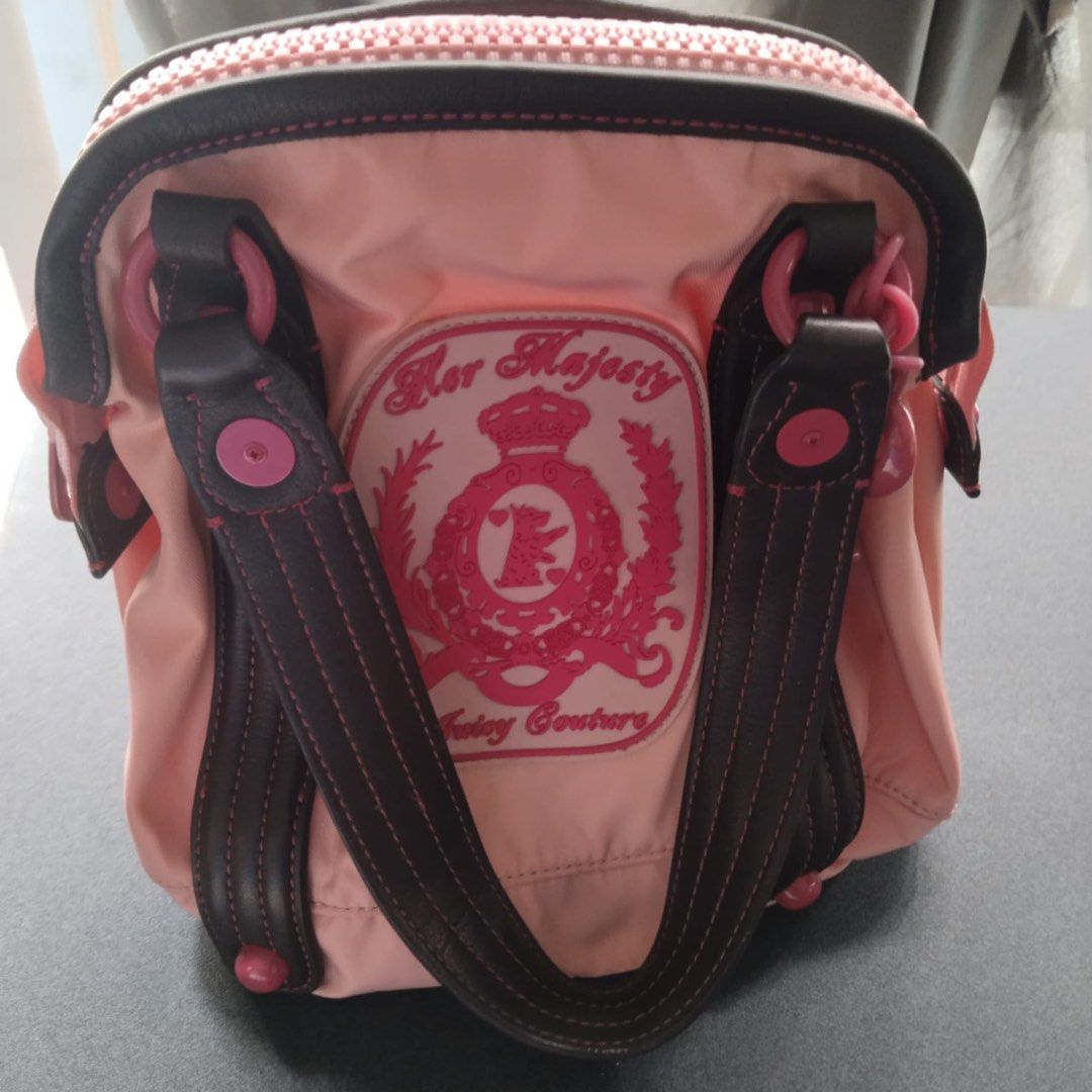 Juicy Couture (Category: Shoulder Bags) located in Quezon City. Submitted by marjoretz (Listing ID 1463570120, Image 2). Description: Vintage Juicy Couture “Her Majesty” Pink & Chocolate Brown Shoulder/ Tote Bag. Y2k-era collectible, nylon body with brown trim ,pink hardware and large Juicy Couture crest. Excellent vintage condition. Purchased in the USA.