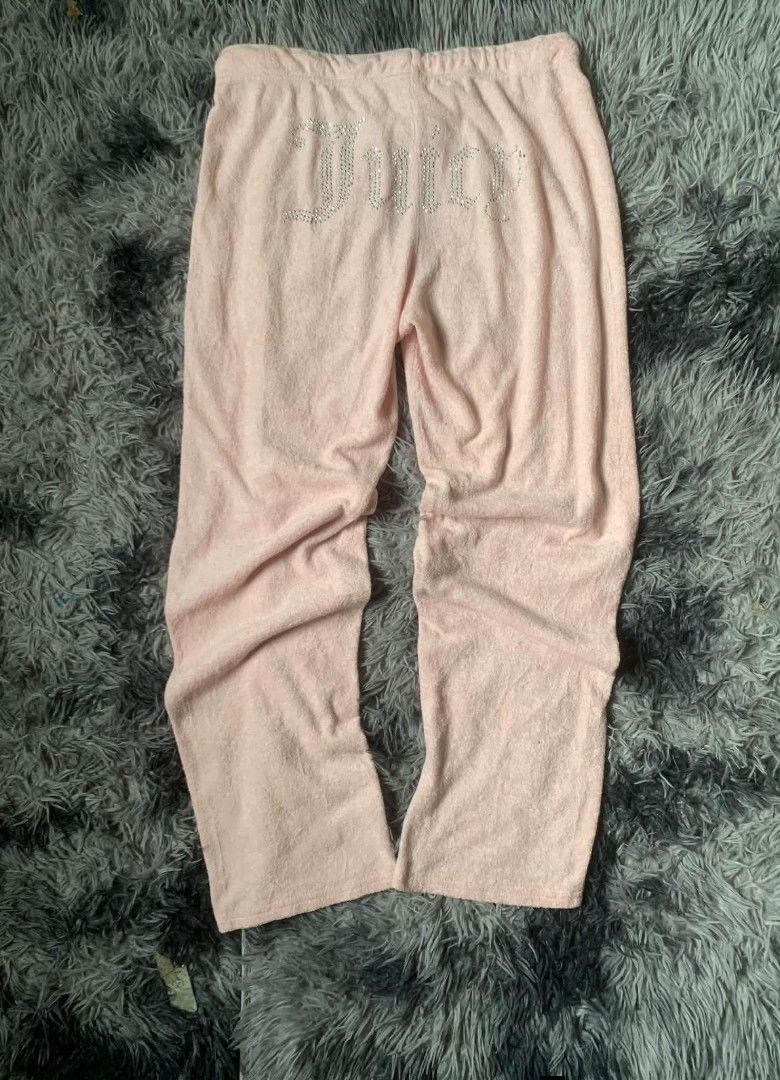 Juicy Couture Velour Track Pants Pink Size S (Category: Jeans) located in Tarlac. Submitted by rhandell_collectives (Listing ID 1463654607, Image 2). Description: - Brand: Juicy Couture - Color: Pink - Material: Velour - Design: Embellished 'Juicy' logo with rhinestones on the back - Features: Elastic waistband with drawstring - Size: S - Origin: Made in China - Perfect for: Lounging or casual wear.