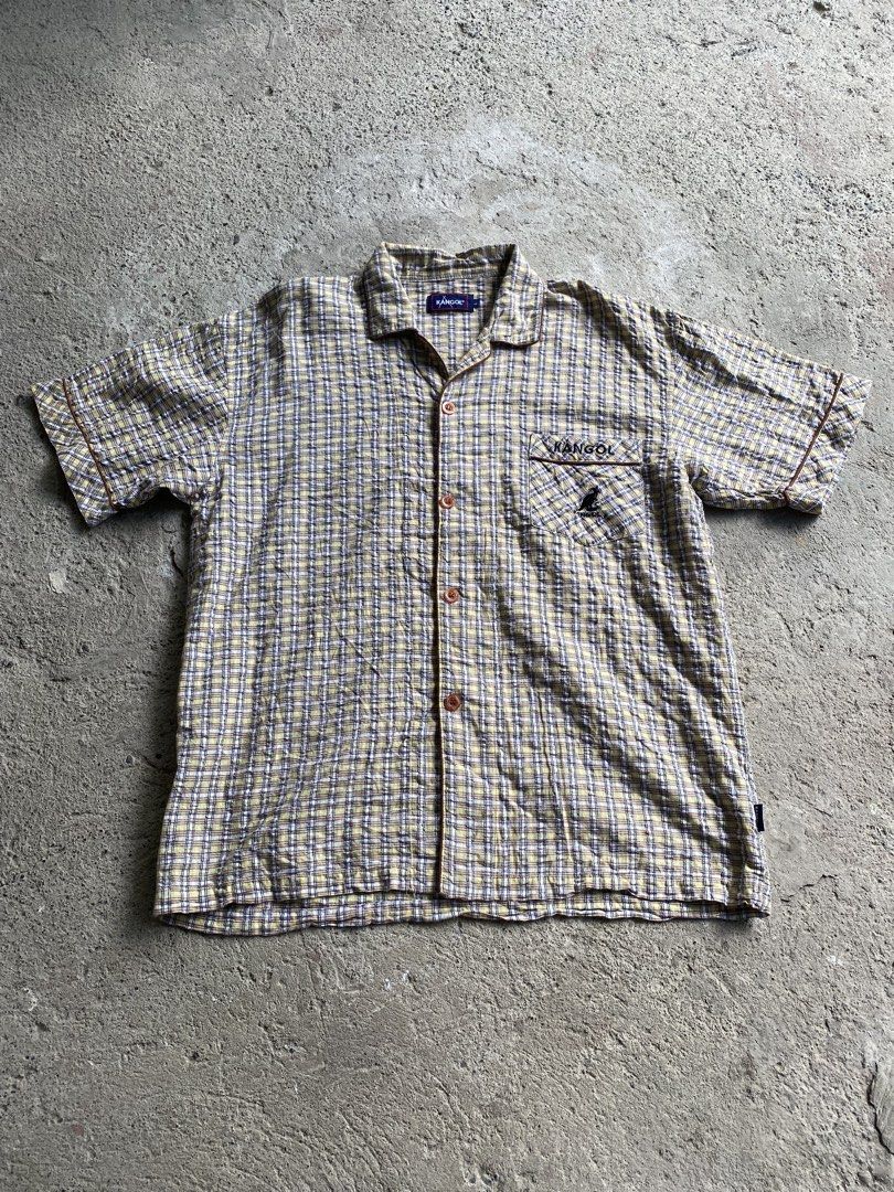 Kangol Plaid Short Sleeve Button Up Shirt (Category: Tshirts & Polo Shirts ) located in Makati City. Submitted by mrbrightside01 (Listing ID 1463627269, Image 2). Description: - Classic Kangol short sleeve shirt - Yellow and blue plaid pattern - Chest pocket with embroidered Kangol logo - Button-up front with brown buttons - Perfect for a casual look - Size: L.