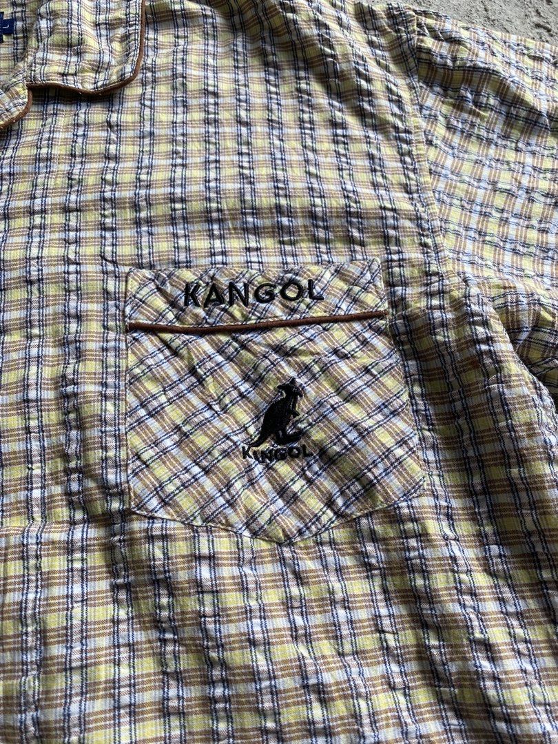 Kangol Plaid Short Sleeve Button Up Shirt (Category: Tshirts & Polo Shirts ) located in Makati City. Submitted by mrbrightside01 (Listing ID 1463627269, Image 3). Description: - Classic Kangol short sleeve shirt - Yellow and blue plaid pattern - Chest pocket with embroidered Kangol logo - Button-up front with brown buttons - Perfect for a casual look - Size: L.
