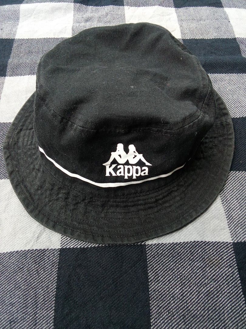 Kappa Black Bucket Hat (Category: Caps & Hats) located in Polomolok. Submitted by timog_high_ice_v2 (Listing ID 1463608450, Image 2). Description: - Classic black bucket hat from Kappa - Features iconic Kappa logo - White stripe detail for a sporty touch - Ideal for sunny days - Adds a sporty vibe to any outfit - Easy to pack and wear on the go Pang daily 🫶.