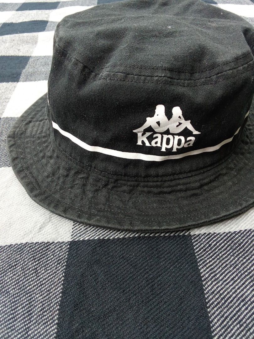 Kappa Black Bucket Hat (Category: Caps & Hats) located in Polomolok. Submitted by timog_high_ice_v2 (Listing ID 1463608450, Image 1). Description: - Classic black bucket hat from Kappa - Features iconic Kappa logo - White stripe detail for a sporty touch - Ideal for sunny days - Adds a sporty vibe to any outfit - Easy to pack and wear on the go Pang daily 🫶.