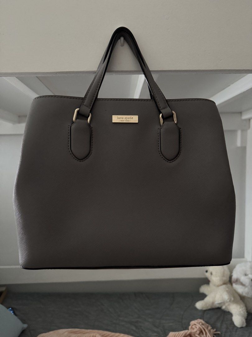 Kate Spade Grey Leather Tote Bag with Shoulder Strap (Category: Tote Bags) located in Las Pinas. Submitted by megalleon8 (Listing ID 1463655104, Image 1). Description: - Genuine leather Kate Spade tote bag in a stylish grey color. - Elegant gold-tone hardware. - Comfortable top handles for easy carrying. - Includes a detachable shoulder strap for versatile wear. - Well-organized interior with a secure zip pocket and multiple compartments. - Both 