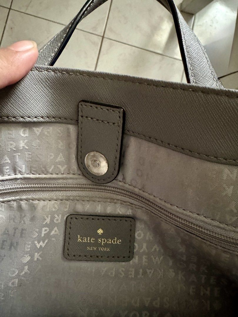 Kate Spade Grey Leather Tote Bag with Shoulder Strap (Category: Tote Bags) located in Las Pinas. Submitted by megalleon8 (Listing ID 1463655104, Image 3). Description: - Genuine leather Kate Spade tote bag in a stylish grey color. - Elegant gold-tone hardware. - Comfortable top handles for easy carrying. - Includes a detachable shoulder strap for versatile wear. - Well-organized interior with a secure zip pocket and multiple compartments. - Both 