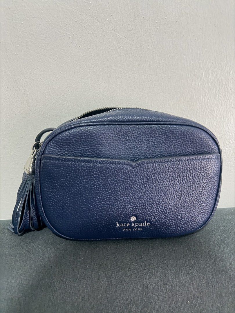 Kate Spade Leather Crossbody Bag (Category: Cross-body Bags) located in Taguig. Submitted by cz.shop (Listing ID 1463699015, Image 2). Description: - Brand: Kate Spade - Color: Navy Blue - Material: Leather - Style: Crossbody Bag - Features: Signature spade logo, side tassel detail - Closure: Zipper - Interior: Fits essentials - Ideal for: Everyday use.