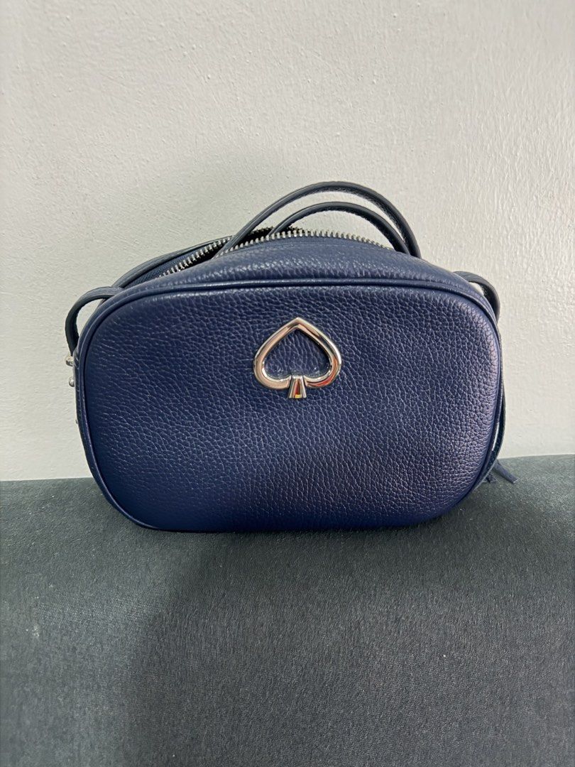 Kate Spade Leather Crossbody Bag (Category: Cross-body Bags) located in Taguig. Submitted by cz.shop (Listing ID 1463699015, Image 1). Description: - Brand: Kate Spade - Color: Navy Blue - Material: Leather - Style: Crossbody Bag - Features: Signature spade logo, side tassel detail - Closure: Zipper - Interior: Fits essentials - Ideal for: Everyday use.