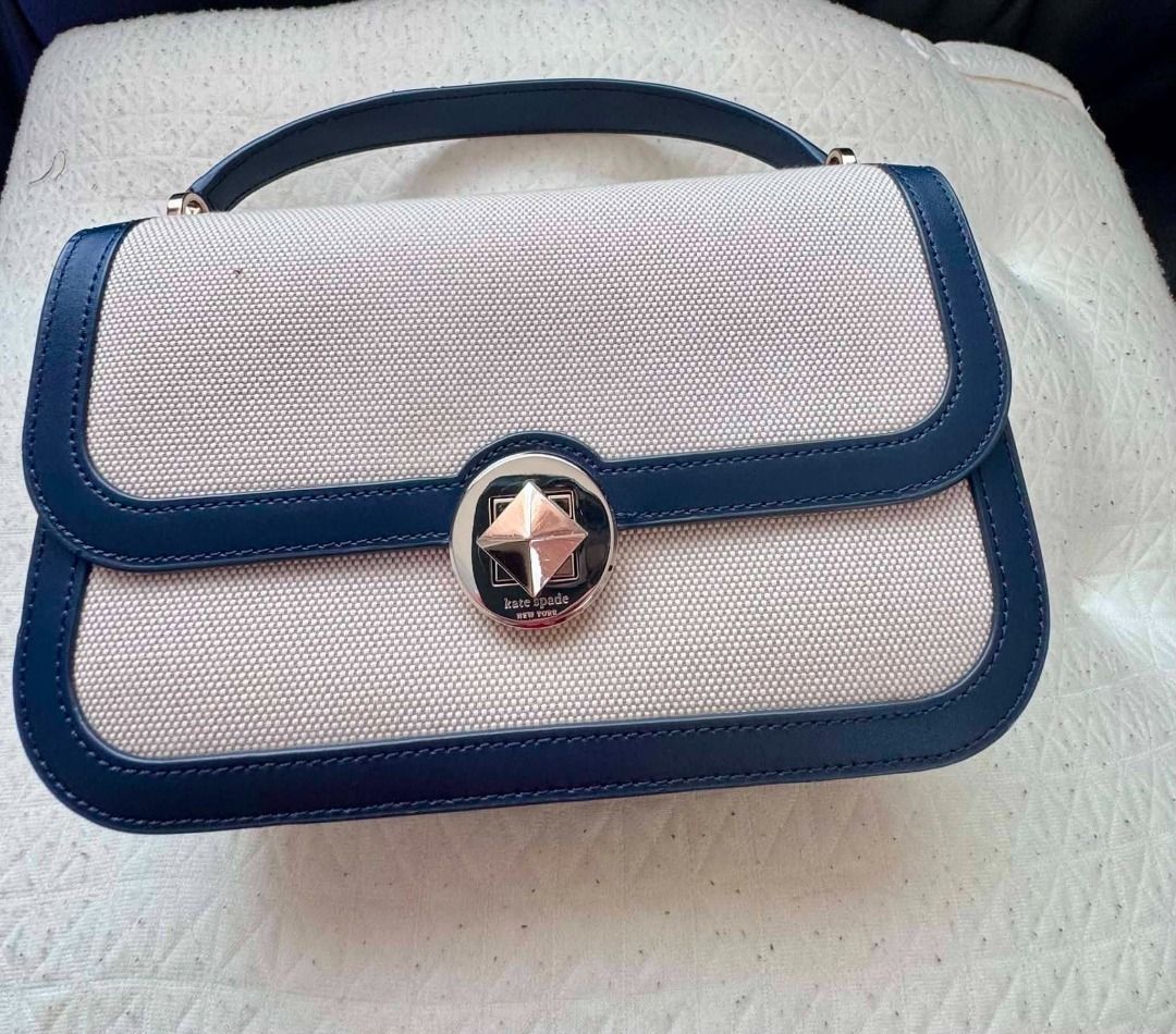 Kate Spade New York Canvas & Leather Shoulder Bag (Category: Luxury Bags & Wallets) located in Labrador. Submitted by bagwalletaccessoriesfromjapan (Listing ID 1463633071, Image 1). Description: FOR SALE: Kate Spade Audrey Canvas Top Handle Flap Crossbody — Blazer will be available this December - ✅ Authentic Kate Spade — Audrey Flap Crossbody (Blazer Colorway) - 🤎 Natural canvas body with rich navy leather trim — classic & sophisticated - 🎒 IN