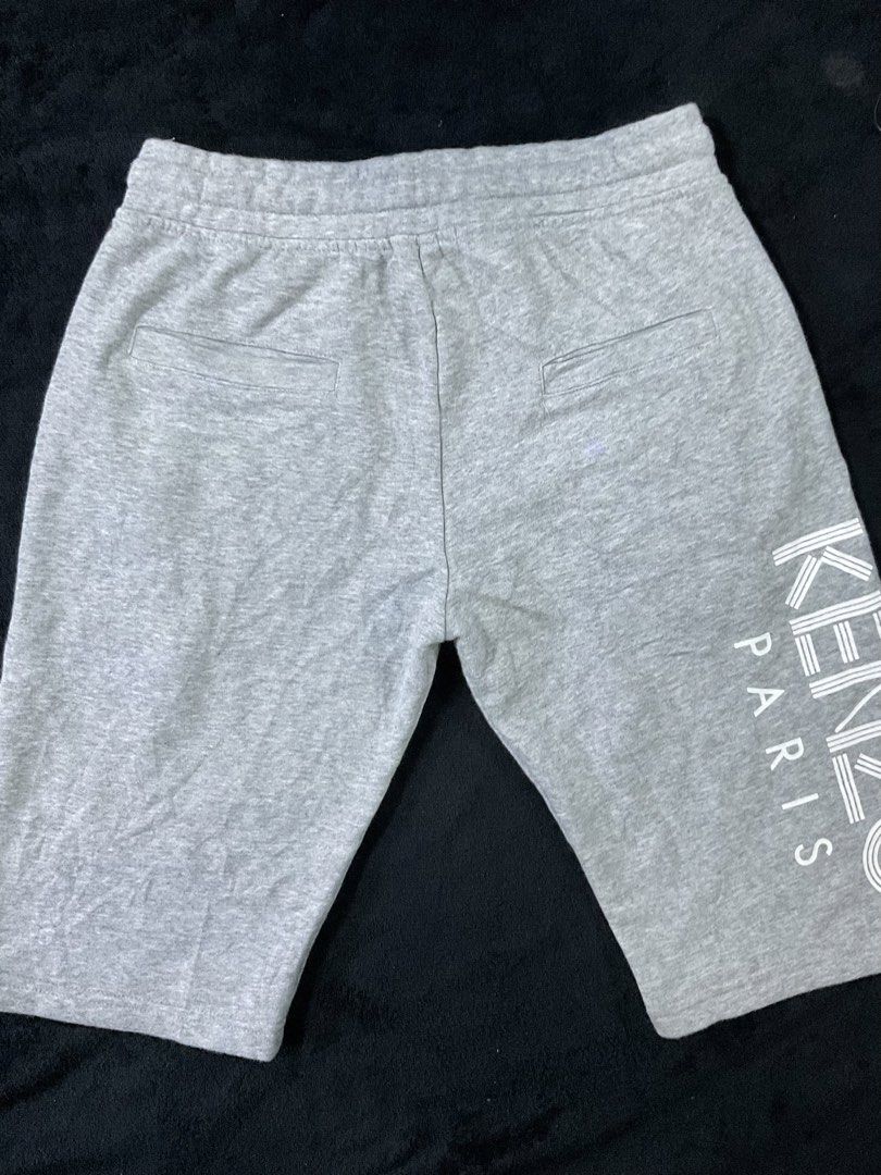 Kenzo Paris Grey Sweat Shorts Size L (Category: Shorts) located in Tuguegarao City. Submitted by lemdulin_ (Listing ID 1463620474, Image 2). Description: - Grey Kenzo Paris sweat shorts - Size L - Elastic waistband with drawstring - Front and back pockets - Vertical Kenzo Paris logo print on the side - Comfortable material.