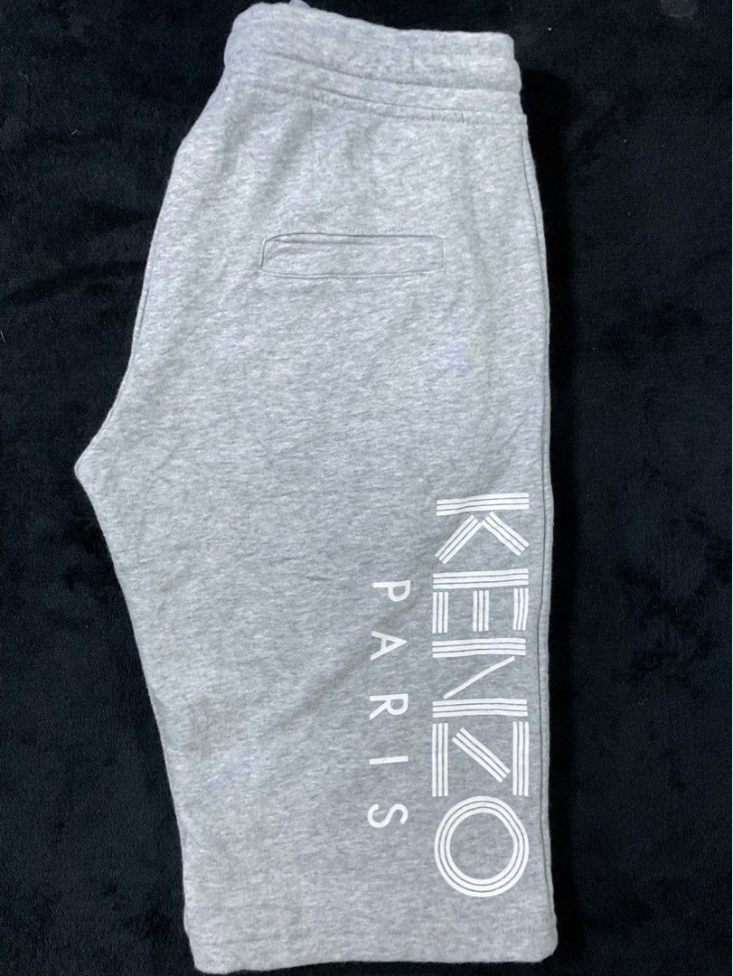 Kenzo Paris Grey Sweat Shorts Size L (Category: Shorts) located in Tuguegarao City. Submitted by lemdulin_ (Listing ID 1463620474, Image 3). Description: - Grey Kenzo Paris sweat shorts - Size L - Elastic waistband with drawstring - Front and back pockets - Vertical Kenzo Paris logo print on the side - Comfortable material.