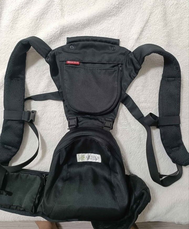 Kerata Baby Carrier (Category: Carriers & Slings) located in Manila. Submitted by luvvicia_21 (Listing ID 1463605223, Image 1). Description: - Black Kerata baby carrier - Padded shoulder straps for comfort - Multiple pockets for convenient storage - Adjustable straps for a secure and personalized fit - Ideal for hands-free baby carrying.