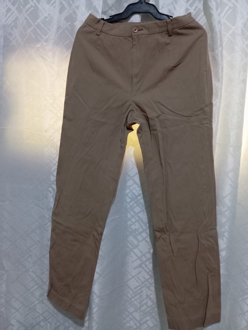 Khaki Trousers (Category: Other Bottoms) located in Dasmarinas. Submitted by kei05 (Listing ID 1463569468, Image 1). Description: - Classic fit khaki trousers - Button and zip front closure - Two front pockets - Two back pockets - Perfect for casual or smart casual outfits - Easy to pair with various tops Waist 25 inches Length 37 inches.