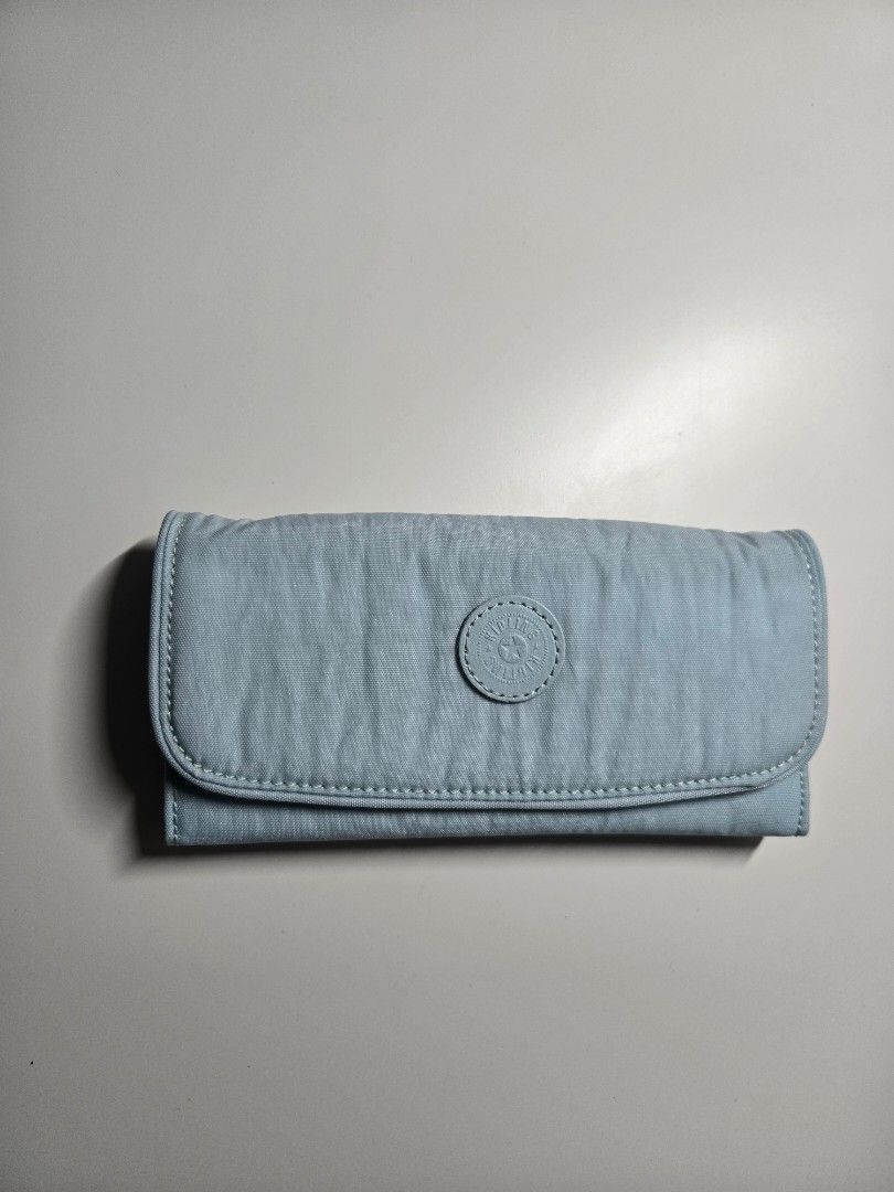 Kipling Blue Wallet Organizer (Category: Wallets & Card holders) located in Cagayan de Oro. Submitted by itsnaja (Listing ID 1463693332, Image 1). Description: - Light blue Kipling wallet - Secure snap closure - Numerous card slots and compartments - Zippered coin pocket - Ideal for on-the-go organization never been used .