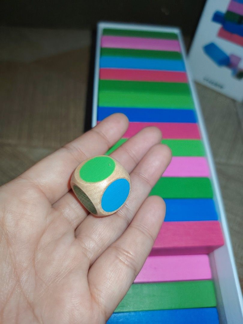 KLODSMAJOR Stacking Tower Game by TIGER (Category: Board Games & Puzzles) located in Santiago. Submitted by aceheart0118672 (Listing ID 1463587731, Image 2). Description: - Fun stacking tower game suitable for all ages. - Comes with colorful wooden blocks and a die. - Ideal for family game nights or parties. - Easy to set up and play. - All blocks are present and accounted for. - Ready for your next game night!.