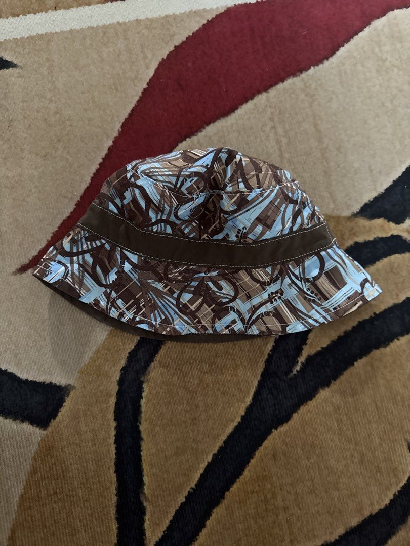 Koala Kids Bucket Hat 6-12 Months (Category: Babies & Kids Fashion) located in Quezon City. Submitted by thebubbly (Listing ID 1463628236, Image 1). Description: - Adorable bucket hat for babies - Reversible design: abstract print (brown/blue) on one side, plain brown on the other - Ideal for sun protection on sunny days - Fits babies aged 6-12 months.
