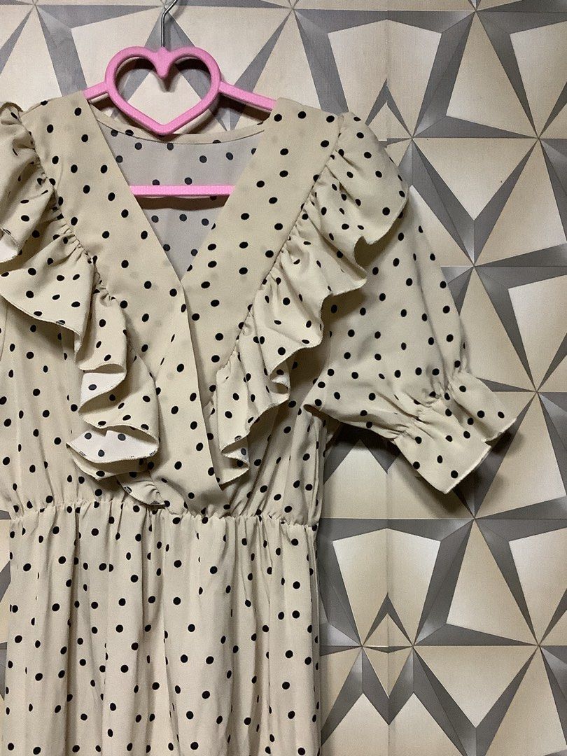 Korean Style Polka Dot Ruffle Maxi Dress (Category: Dresses) located in Quezon City. Submitted by lovedbyerara (Listing ID 1463683095, Image 2). Description: Pattern: Small black graphic polka dots Color: Beige base Neckline: Deep crossover V-neck with ruffle trim Sleeves: Short flutter / ruffle sleeves Waist: Elasticized high waist for a flexible fit Length: Maxi / Long length ankle-skimming cut.
