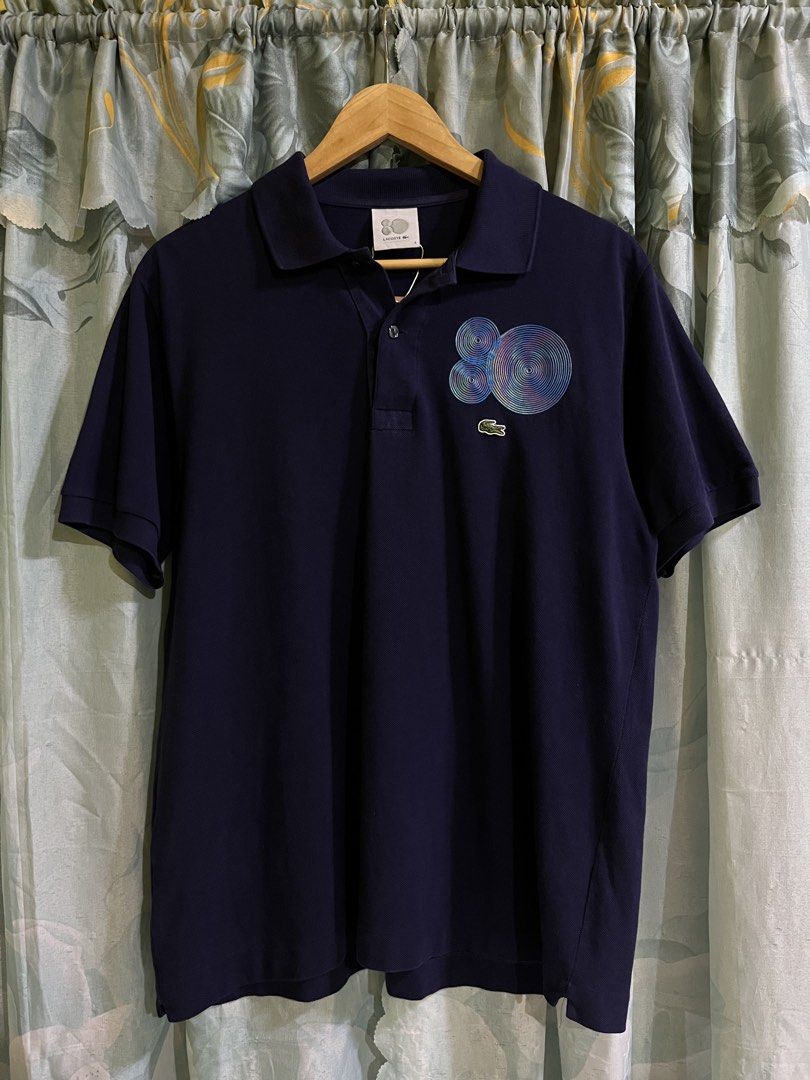 Lacoste "Celebrating Eighty" Navy Blue Polo Shirt (Category: Tshirts & Polo Shirts ) located in Bacolod City. Submitted by jem111111 (Listing ID 1463671683, Image 1). Description: Size 4 on tag DIMES 21.5x27 28 back no issue no flaws no sign of usage good as new ready to use complete tags original/authentic very presentable free shipping.