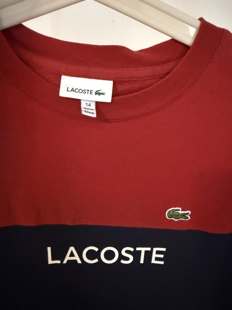 Lacoste T-shirt Red Navy Blue (Category: Babies & Kids Fashion) located in Pasig City. Submitted by rajesh.rajesh (Listing ID 1463621001, Image 2). Description: - Authentic Lacoste T-shirt - Color: Red and Navy Blue - Size: 14 - Features classic Lacoste crocodile logo and text - Stylish and good-looking -- width -17 inch; length - 23 inch; shoulder -15 inch - almost new - just opened and kept not used ! - it was gift didn’t fit my son . - check m