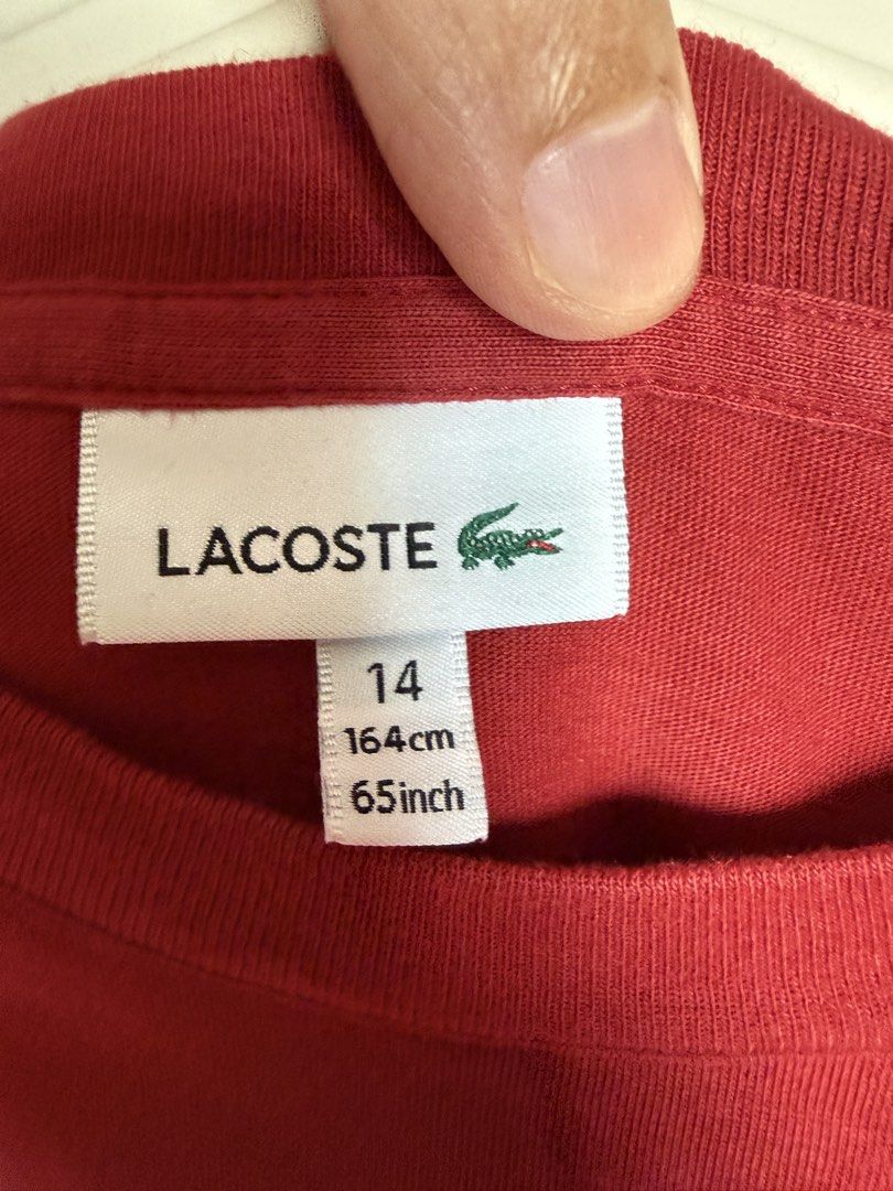 Lacoste T-shirt Red Navy Blue (Category: Babies & Kids Fashion) located in Pasig City. Submitted by rajesh.rajesh (Listing ID 1463621001, Image 3). Description: - Authentic Lacoste T-shirt - Color: Red and Navy Blue - Size: 14 - Features classic Lacoste crocodile logo and text - Stylish and good-looking -- width -17 inch; length - 23 inch; shoulder -15 inch - almost new - just opened and kept not used ! - it was gift didn’t fit my son . - check m