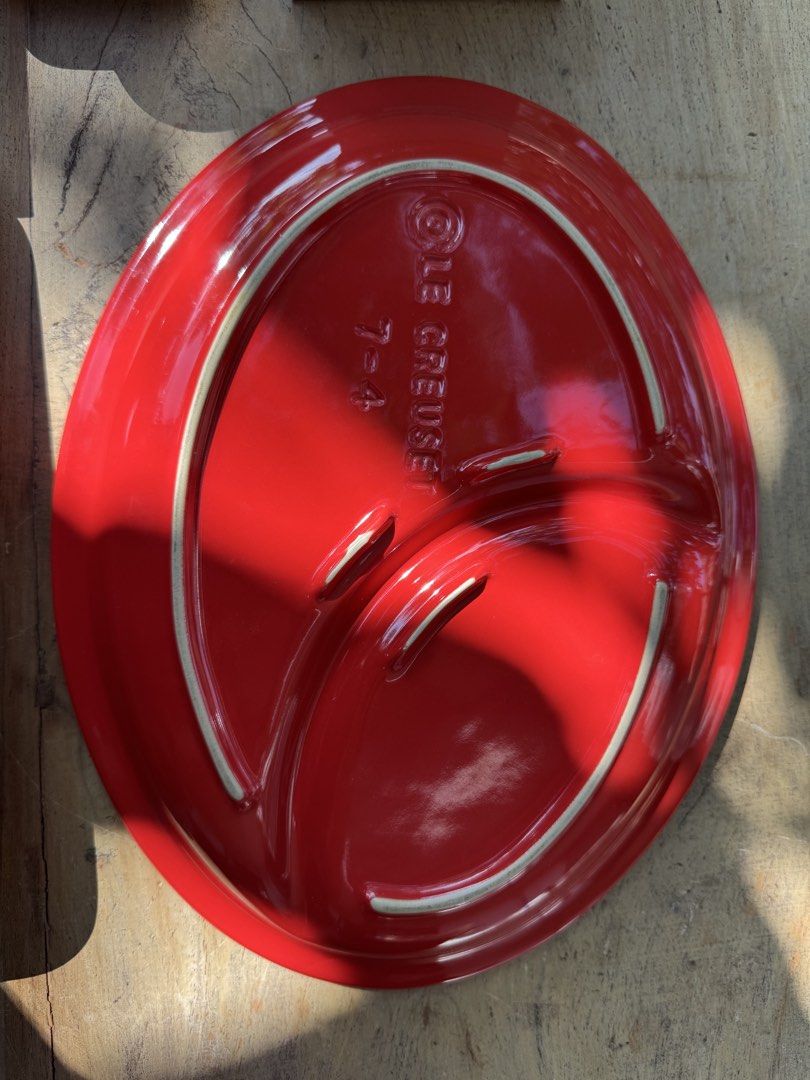 Le Creuset Red Round Plate 7-4 (Category: Dinnerware & Cutlery) located in Naga. Submitted by ehloysah (Listing ID 1463590118, Image 2). Description: - Authentic Le Creuset plate in vibrant red. - Size: 7.4 inches. - Features embossed Le Creuset branding on the back. - Perfect for serving dishes or as a decorative accent. - Shows light scratches from normal use, but maintains a beautiful shine..