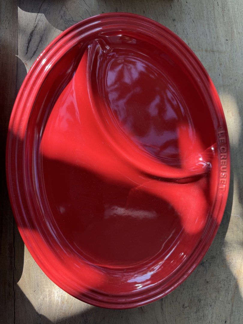 Le Creuset Red Round Plate 7-4 (Category: Dinnerware & Cutlery) located in Naga. Submitted by ehloysah (Listing ID 1463590118, Image 1). Description: - Authentic Le Creuset plate in vibrant red. - Size: 7.4 inches. - Features embossed Le Creuset branding on the back. - Perfect for serving dishes or as a decorative accent. - Shows light scratches from normal use, but maintains a beautiful shine..