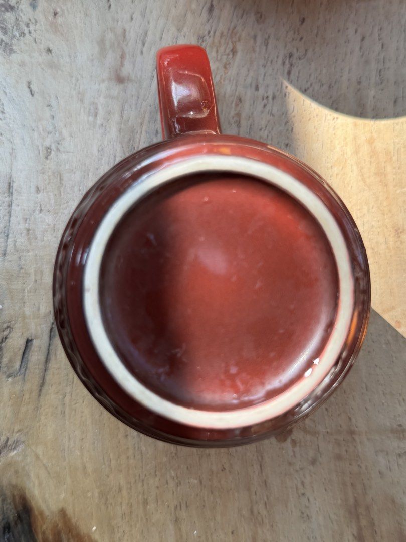 Le Creuset Stoneware Mug Cherry Red (Category: Coffee & Tea Tableware) located in Naga. Submitted by ehloysah (Listing ID 1463589488, Image 2). Description: - Classic Le Creuset mug in a deep cherry red. - Made from durable stoneware. - Ideal size for your morning coffee or tea. - Features a light cream-colored interior. - Le Creuset logo embossed on the bottom. - A stylish addition to any kitchenware collection..