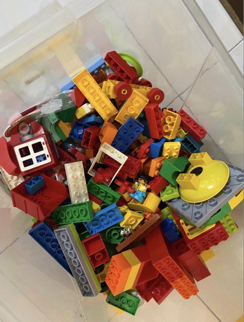 LEGO DUPLO Building Blocks and Figures (Category: Lego & Building Sets) located in Cainta. Submitted by jebo17 (Listing ID 1463577035, Image 2). Description: Mix of original and not original duplo lego with box. Includes bricks, wheels, and character pieces in various sizes and colors. Some are LEGO DUPLO. From a smoke-free home..