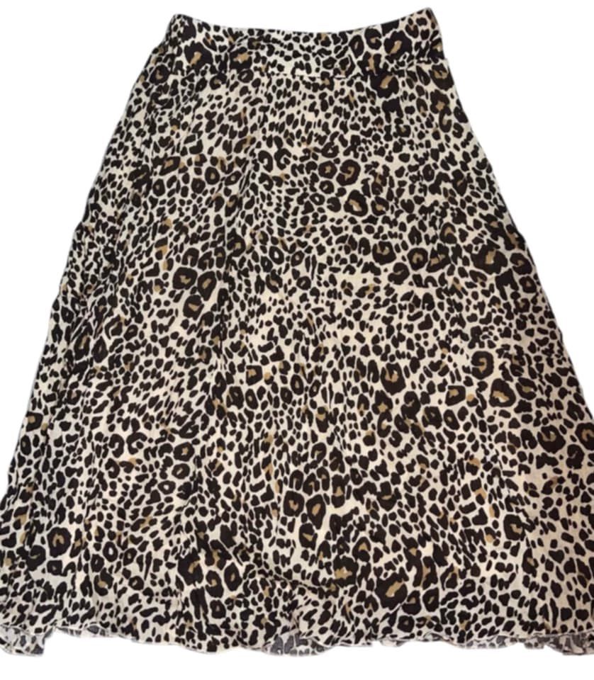 Leopard Print Midi Skirt (Category: Skirts) located in Manila. Submitted by fastforest_65f95b (Listing ID 1463665405, Image 1). Description: - Flowy midi skirt - Classic leopard print - Comfortable elastic waistband - Slight ruffle at the hem - Versatile for dressing up or down - Easy to style with any top.