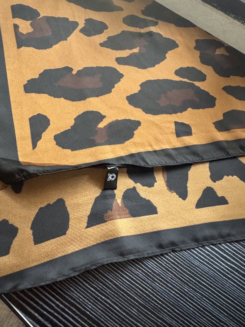 Leopard Print Silk Scarf Accessory (Category: Scarves) located in Quezon City. Submitted by big_fat_momma (Listing ID 1463573924, Image 1). Description: - Eye-catching leopard print scarf - Silky smooth feel - Versatile: wear on neck or tie to your bag - Adds a stylish pop of pattern to any outfit - Approximate dimensions: 67cm x 68cm - Ideal accessory for everyday use - Add safari touch to your outfit. #safari #animalprint #scarf #leopardprint.