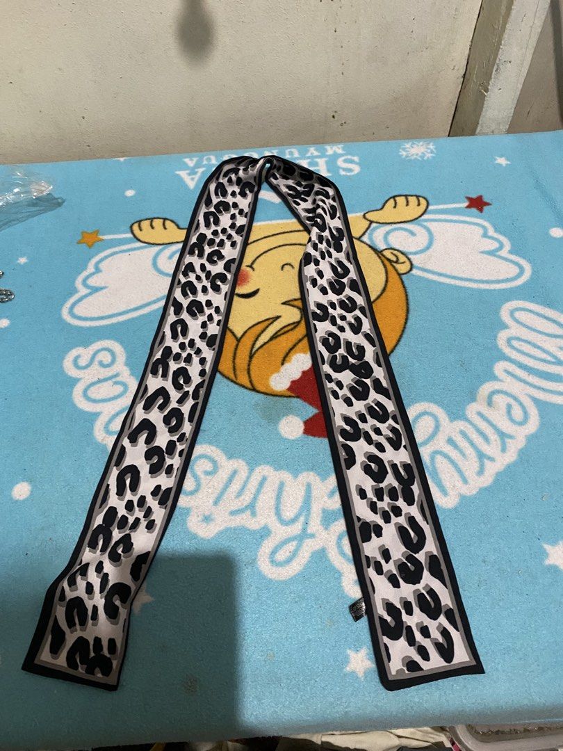 Leopard Print Silk Twilly Scarf (Category: Scarves) located in Manila. Submitted by resi.diaz (Listing ID 1463708242, Image 2). Description: - Cute leopard print scarf - Made of 100% polyester - Measures approximately 120cm long - Wear it around your neck, on your bag, or as a hair tie - Perfect accessory to elevate your style.