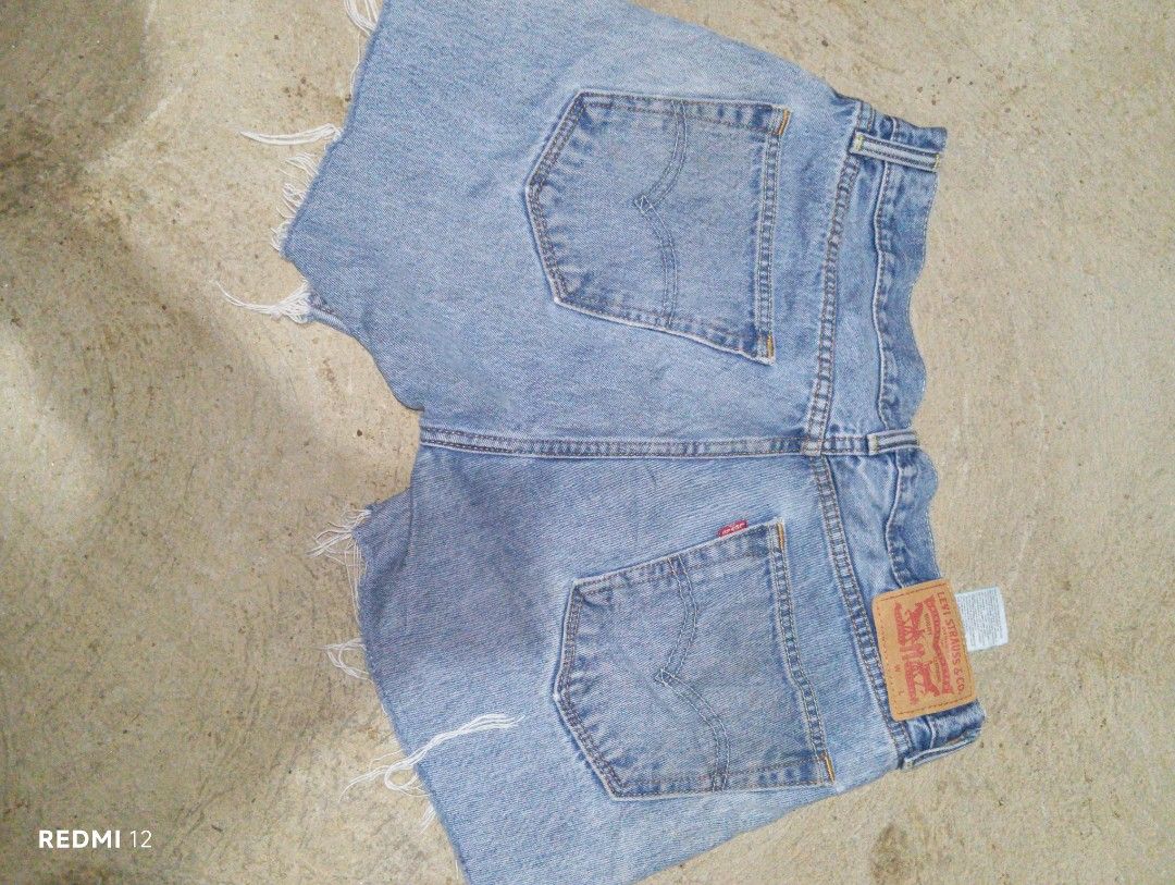 Levi's Denim Shorts (Category: Shorts) located in Sariaya. Submitted by angelochintes732 (Listing ID 1463667783, Image 2). Description: - Classic light wash Levi's denim shorts - Cut-off style with frayed hem - Button fly closure - Two back pockets with signature stitching - Ideal for casual wear.
