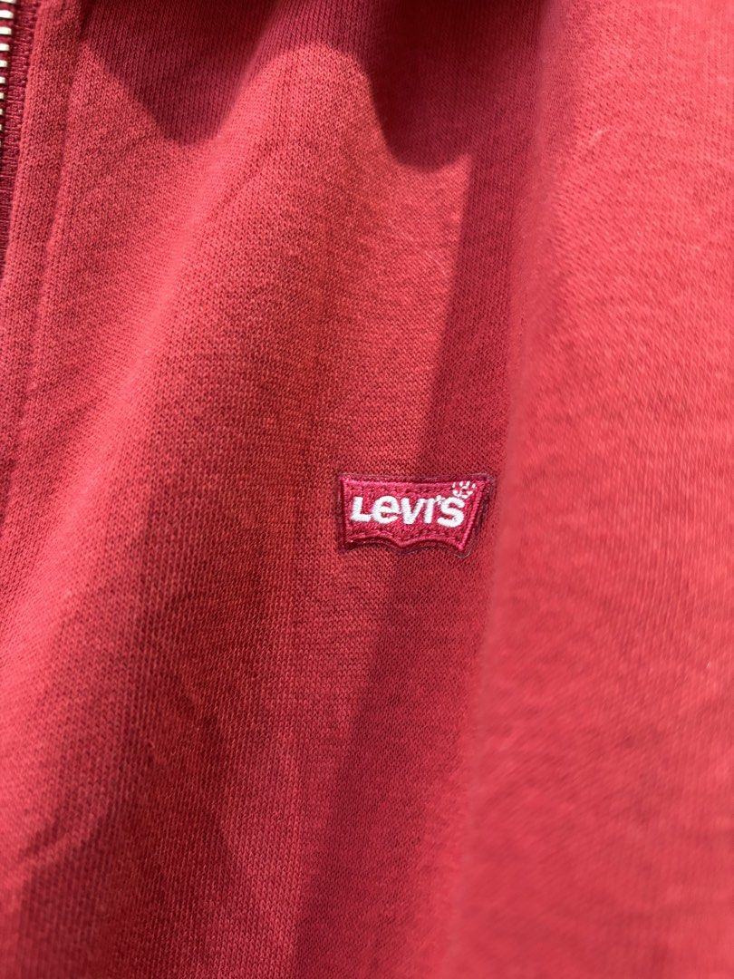 Levi's Red Zip-Up Hoodie Size M (Category: Hoodies) located in Iloilo. Submitted by oddforest.c9c7d5 (Listing ID 1463640148, Image 3). Description: - Classic red Levi's hoodie - Full zip-up front - Kangaroo pocket - Soft fleece lining - Iconic Levi's logo tab on chest - Size M to L - Great for casual wear -missing drawstring -YKK Zipper.