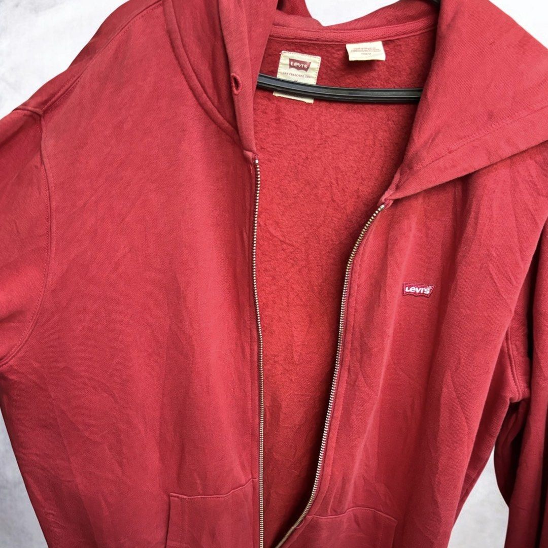 Levi's Red Zip-Up Hoodie Size M (Category: Hoodies) located in Iloilo. Submitted by oddforest.c9c7d5 (Listing ID 1463640148, Image 2). Description: - Classic red Levi's hoodie - Full zip-up front - Kangaroo pocket - Soft fleece lining - Iconic Levi's logo tab on chest - Size M to L - Great for casual wear -missing drawstring -YKK Zipper.
