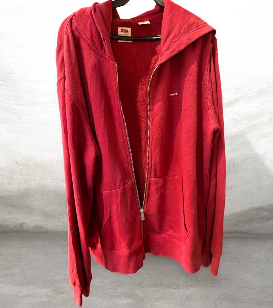 Levi's Red Zip-Up Hoodie Size M (Category: Hoodies) located in Iloilo. Submitted by oddforest.c9c7d5 (Listing ID 1463640148, Image 1). Description: - Classic red Levi's hoodie - Full zip-up front - Kangaroo pocket - Soft fleece lining - Iconic Levi's logo tab on chest - Size M to L - Great for casual wear -missing drawstring -YKK Zipper.